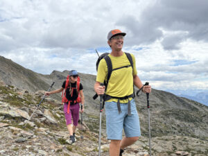 man and woman in hiking gear in an alpine setting on the Esplanade Range in BC