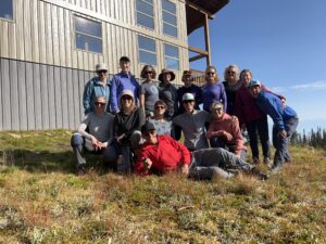 A hiking group photo in front of Sentry lodge