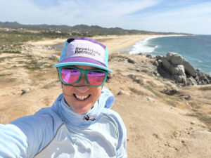 Retreat owner out for a run with the Pacific ocean in the background